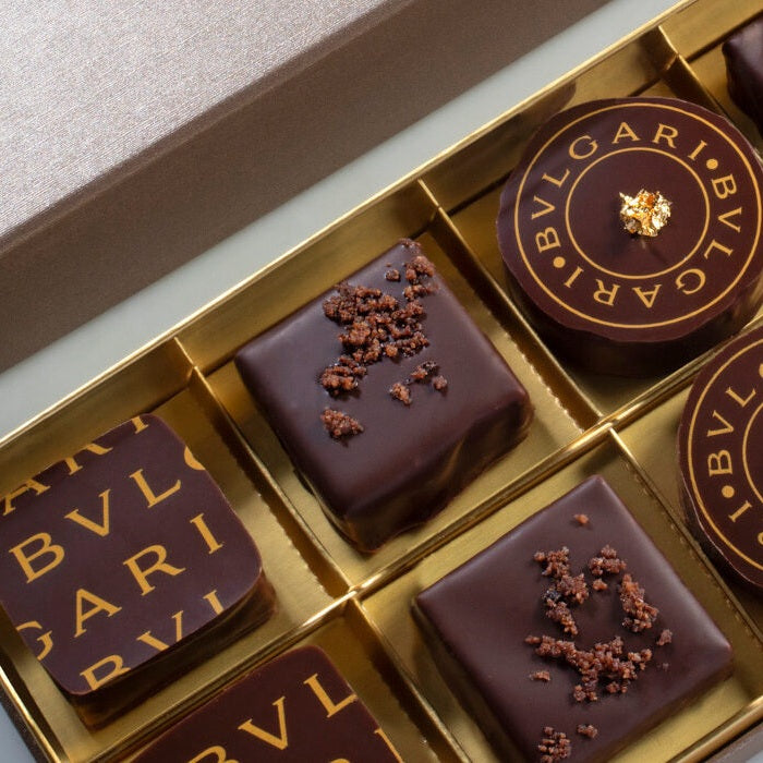 Bulgari chocolate truffles with Bulgari logo printed in gold made with chocolate transfer sheet for magnetic molds