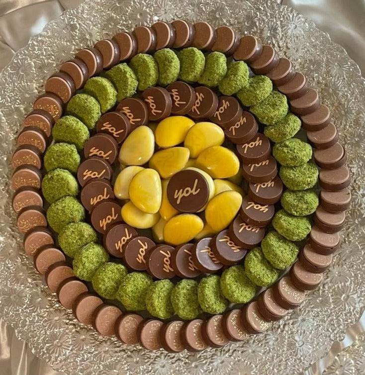 Decorated chocolate with candies and logo printed with chocolate transfer sheets for magnetic molds